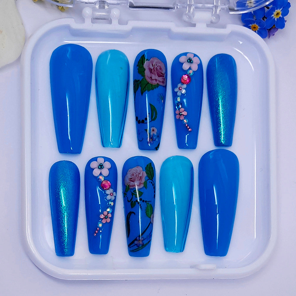 turquoise hand made press on nails, with a mixture of gels, flowers, and 3d nails art