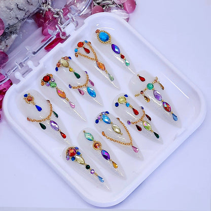 sparkling milky white hand made long stiletto press on nails, with gold chains and gems