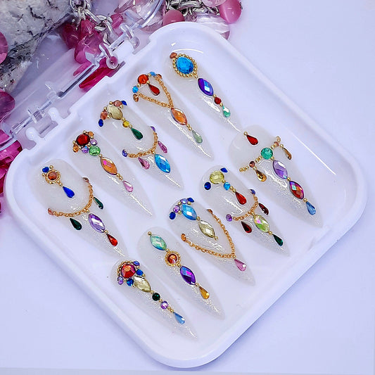 sparkling milky white hand made long stiletto press on nails, with gold chains and gems