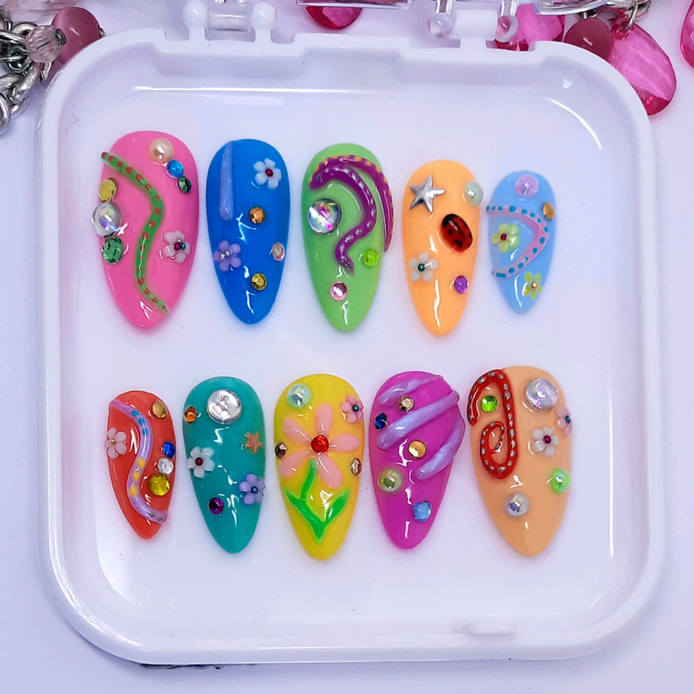 colourful hand made press on nails with lots of fun 3d decoration