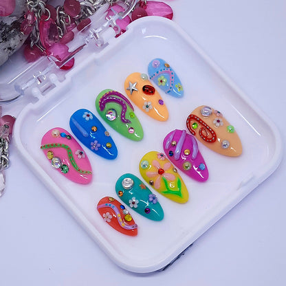 colourful hand made press on nails with lots of fun 3d decoration