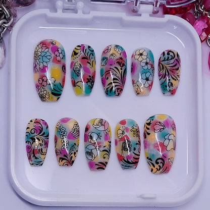 beautiful colourful hand made press on nails with flowers and swirls