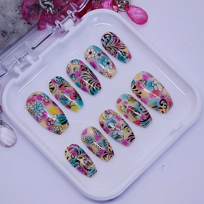 beautiful colourful hand made press on nails with flowers and swirls