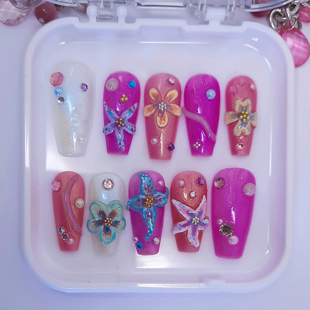 Beautiful shimmering press on nails with trending hand made 3d flowers, with added pearls and gems.