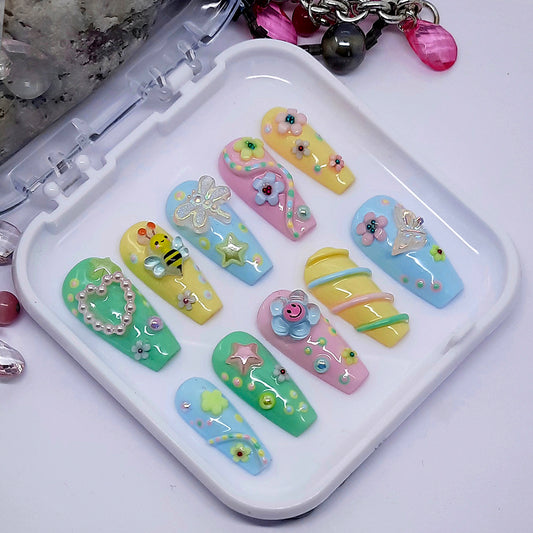 beautiful pastel hand made press on nails with a cute  3d design