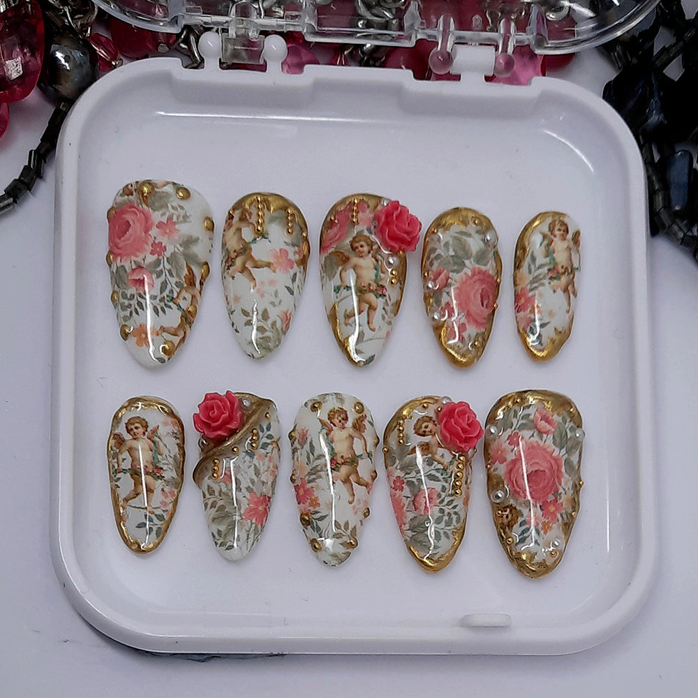 beautiful white press on nails with cherubs and roses, and 3d nails art