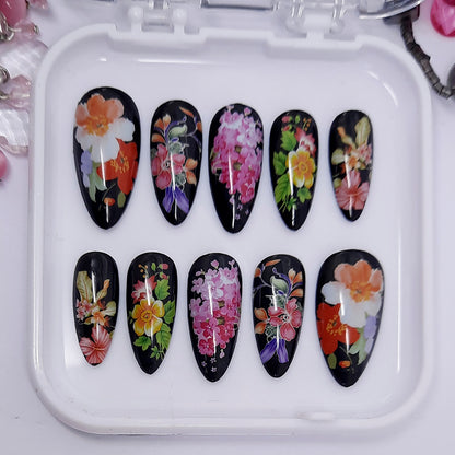 beautiful glossy black press on nails with large colourful flowers