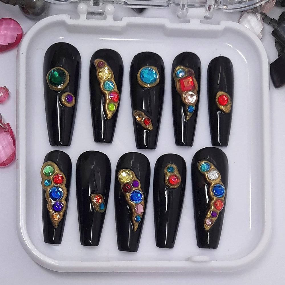 Beautiful black glossy press on nails with colourful gems embedded into 3d gold paste.