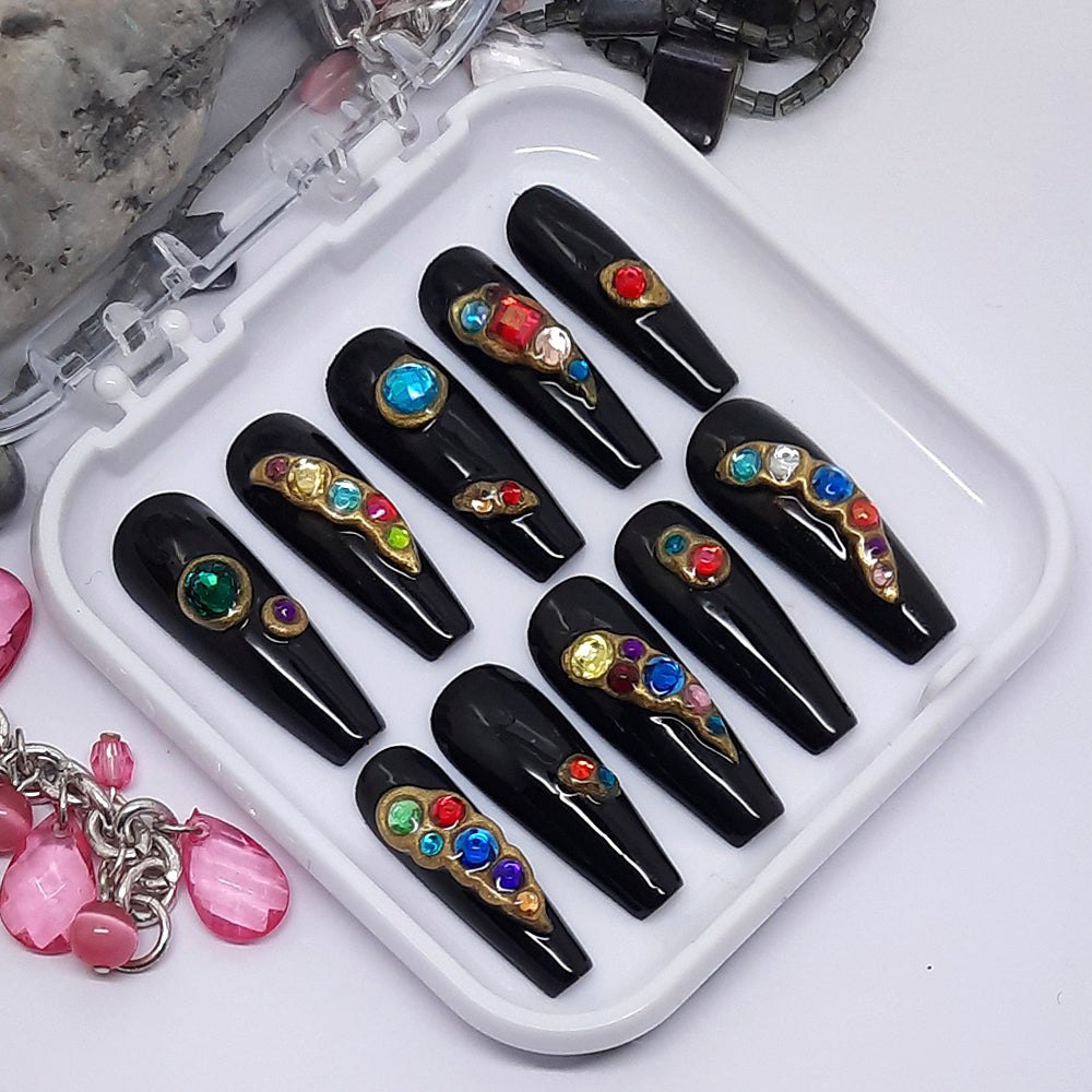 Beautiful black glossy press on nails with colourful gems embedded into 3d gold paste.