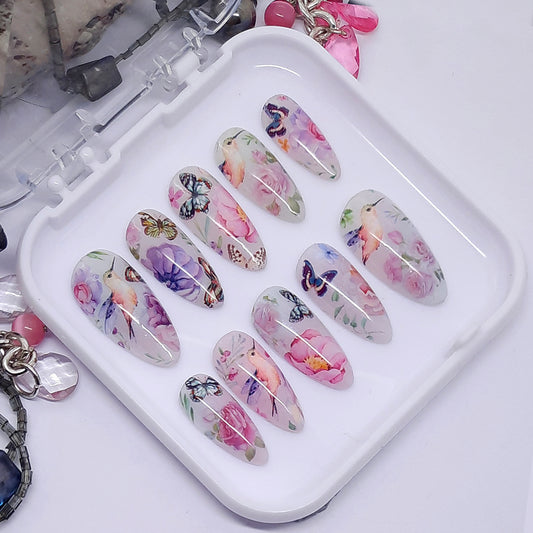 The most beautiful set of press on nails with a pretty design of flowers, birds and butterflies.