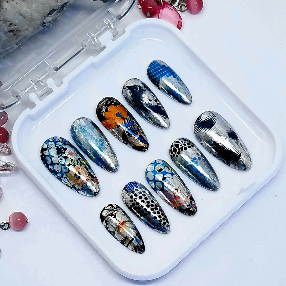 Gorgeous metallic silver press on nails with various animal print and floral designs. Finished in gloss top coat.