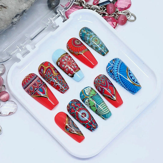 Very beautiful and unique medium coffin press on nails in a colourful mandala design with gold chrome detail. Finished in gloss top coat. 