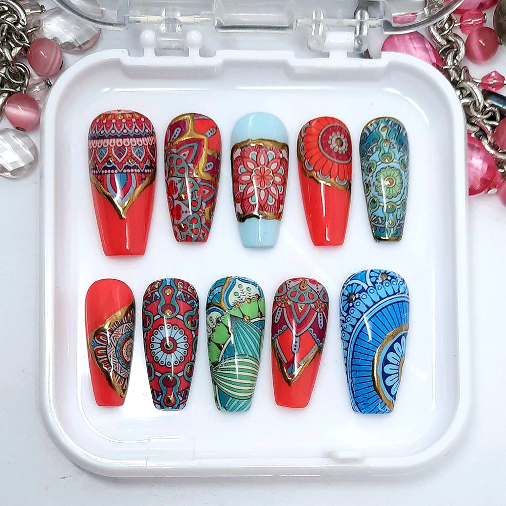 Very beautiful and unique medium coffin press on nails in a colourful mandala design with gold chrome detail. Finished in gloss top coat. 