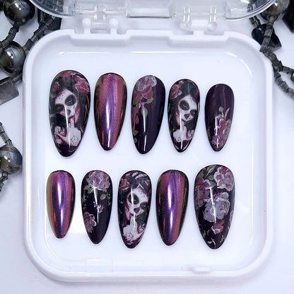 Gorgeous darkest purple press on nails with pink roses, pink/gold colour shift chrome and Halloween vibes. Finished in gloss top coat