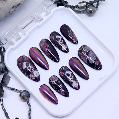 Gorgeous darkest purple press on nails with pink roses, pink/gold colour shift chrome and Halloween vibes. Finished in gloss top coat