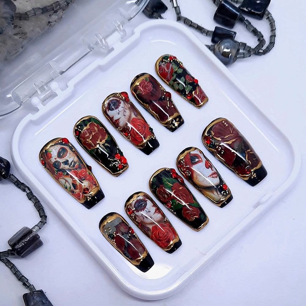 Gorgeous black press on nails with a stunning Day of The Dead design, 3d nail art and gold chrome. Finished in gloss top coat.