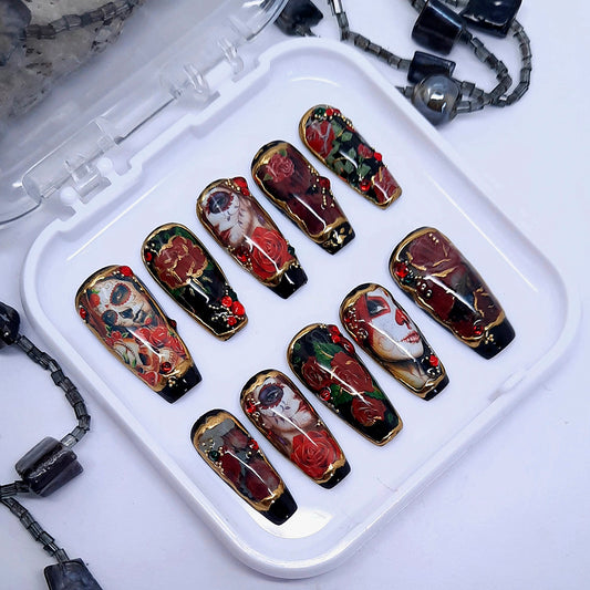 Gorgeous black press on nails with a stunning Day of The Dead design, 3d nail art and gold chrome. Finished in gloss top coat.