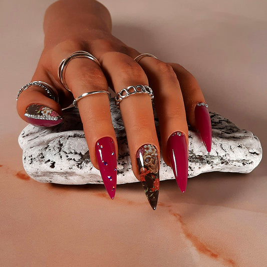 hand made fuchsia pink long stiletto nails with flowers, skulls and gems