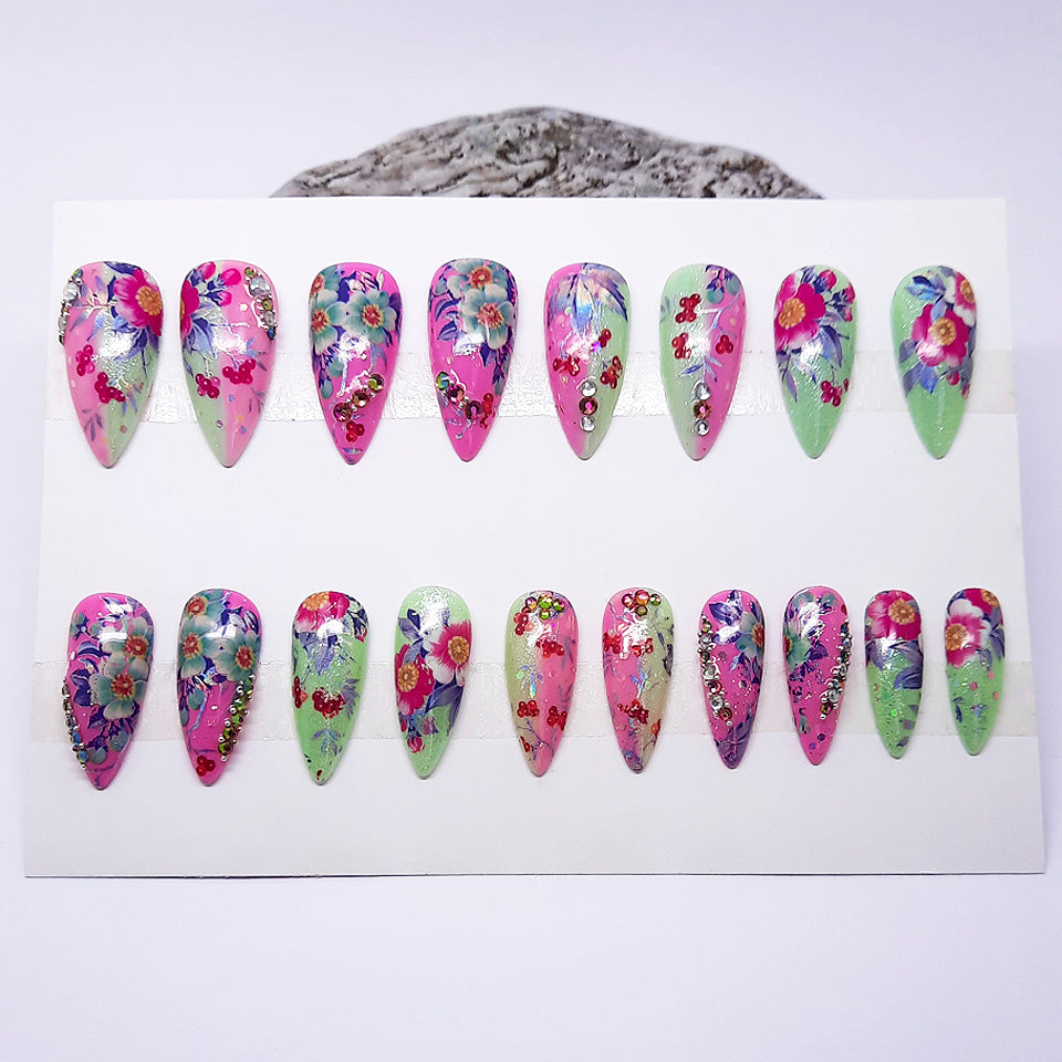Set of floral nail art designs on a white card with a light gray background